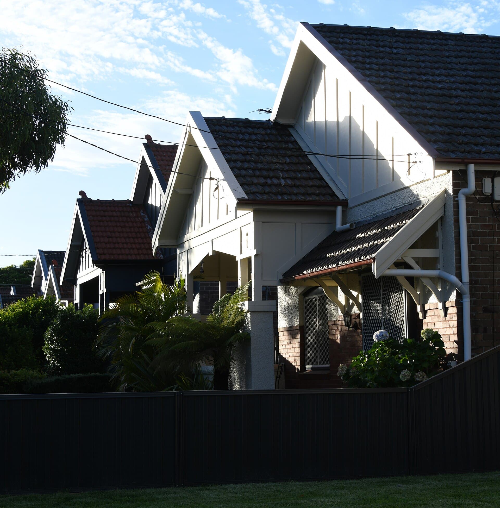 Federation-era brick house with bay window and front garden in Kensington
