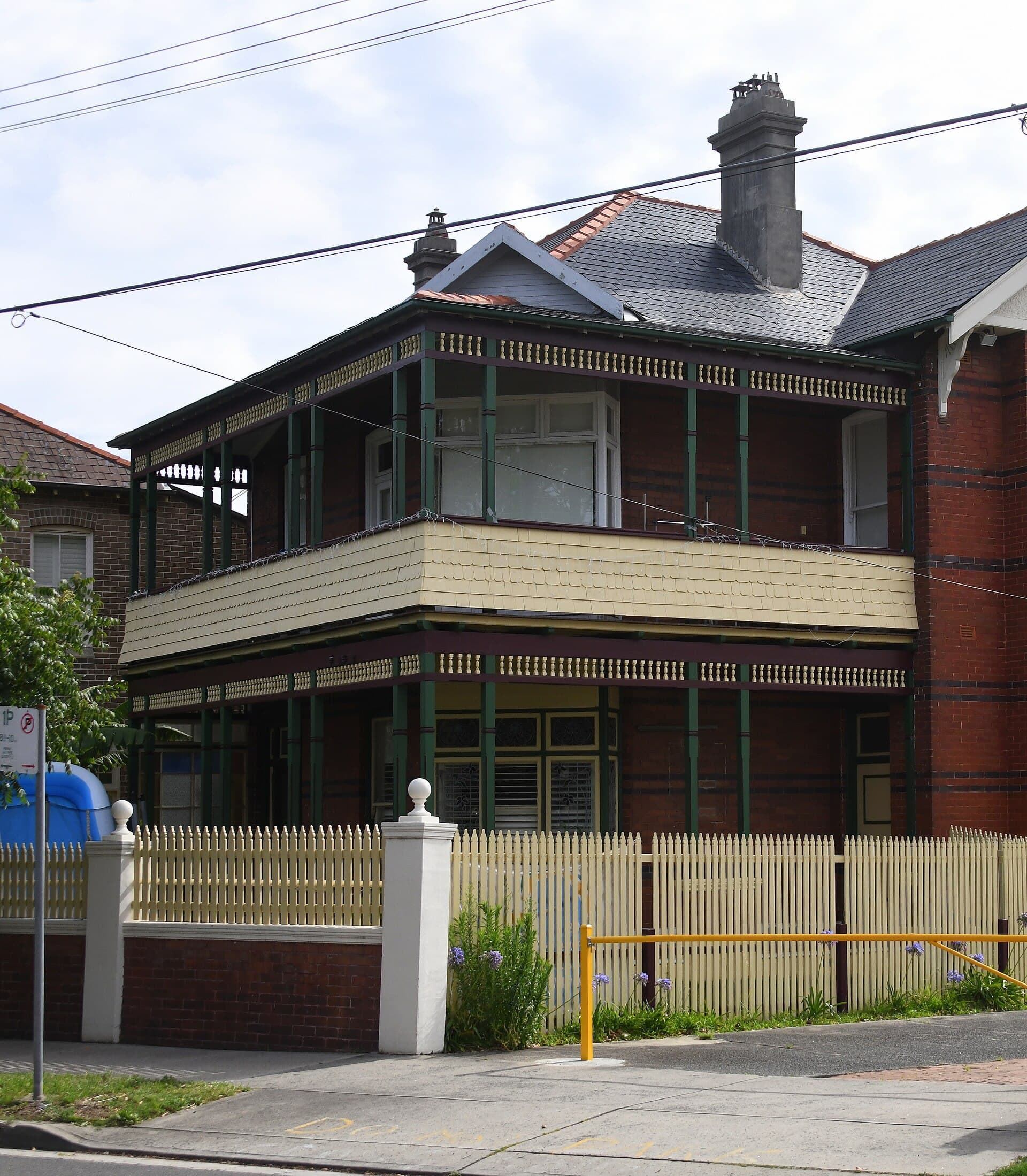 Federation brick house with a timber front door and verandah in Randwick, Sydney
