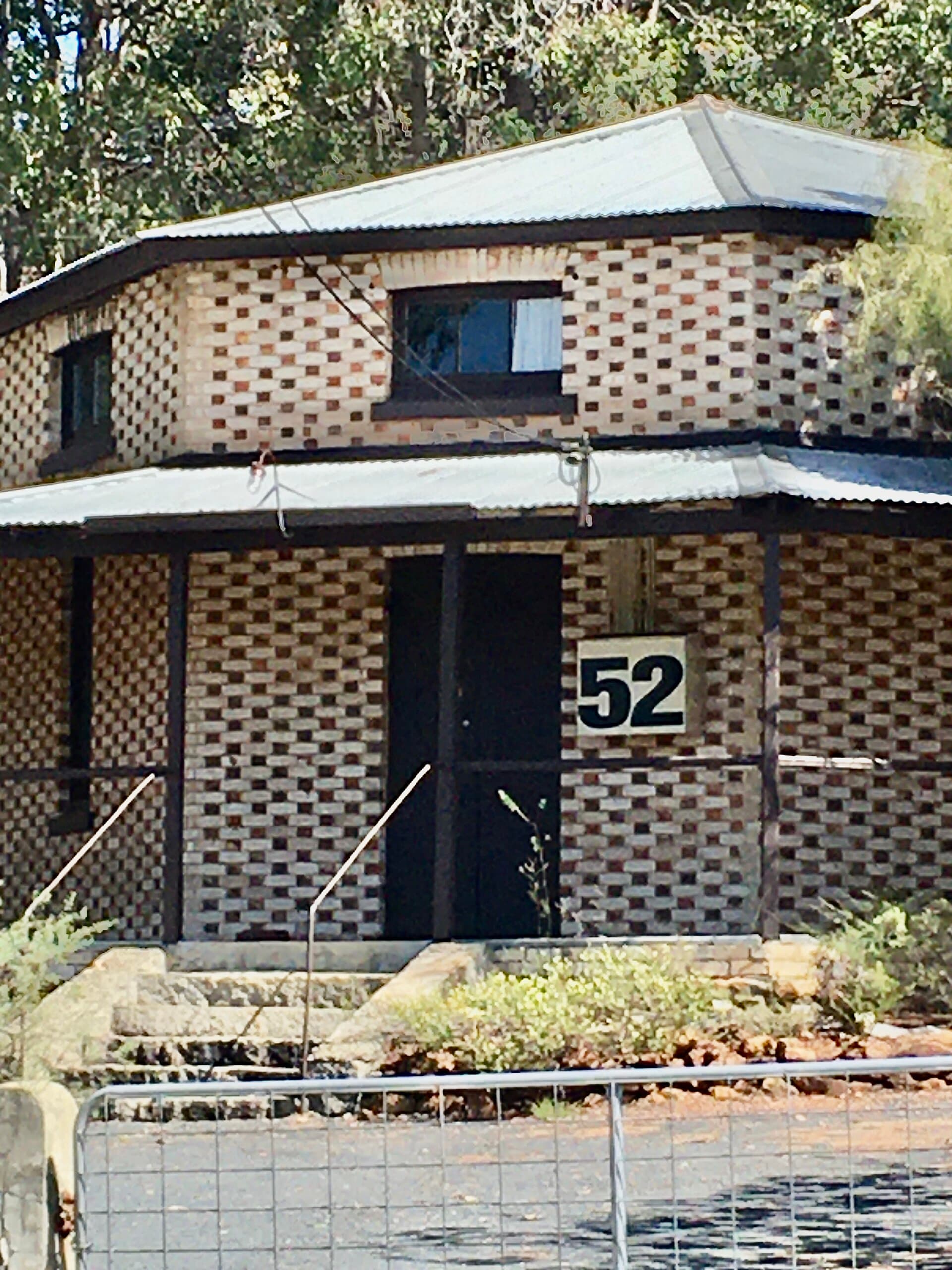 Painted timber entrance door and porch of the Octagonal Hall in Glen Forrest, Western Australia