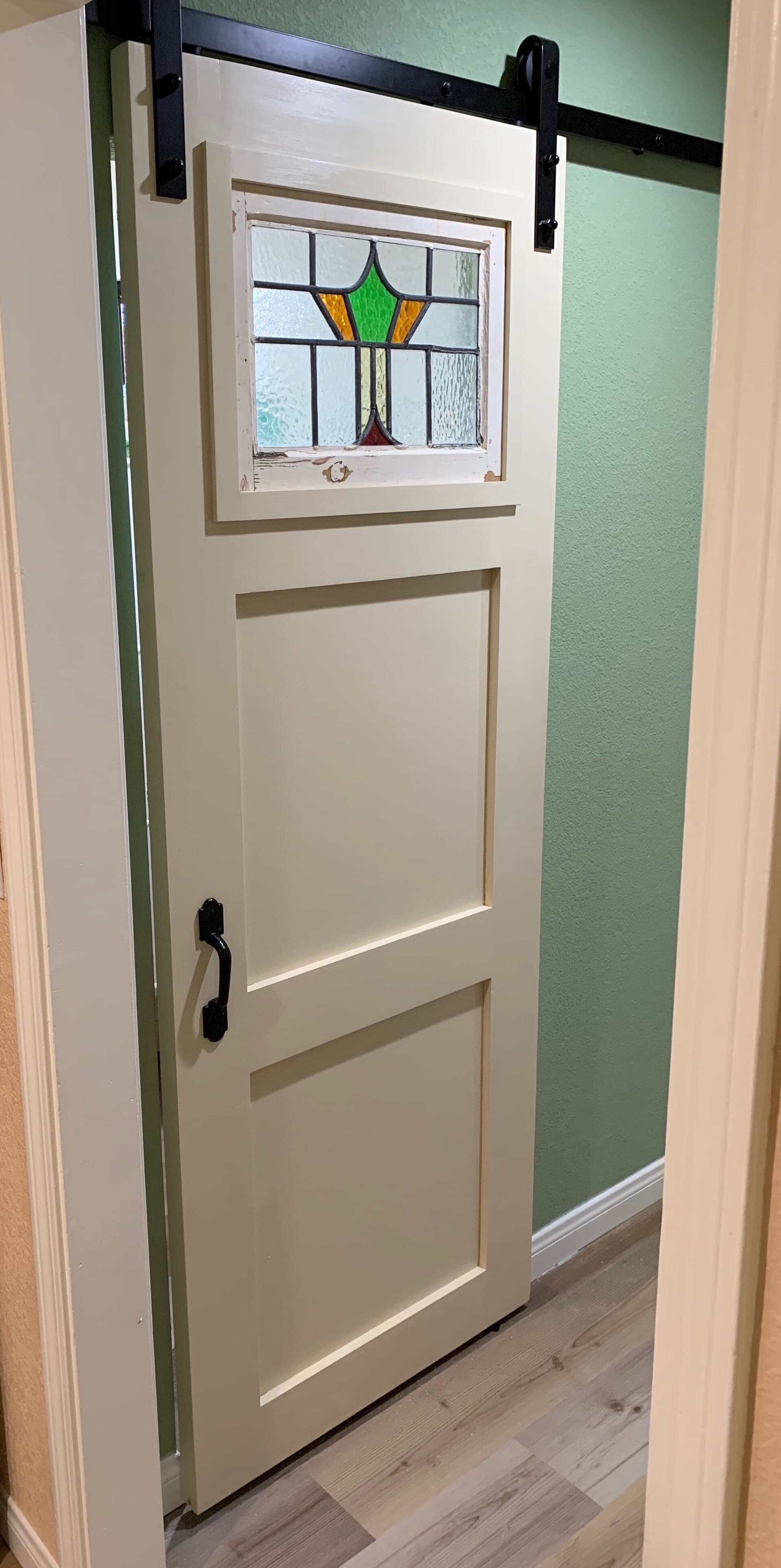 Timber sliding pantry door installed in a suburban home